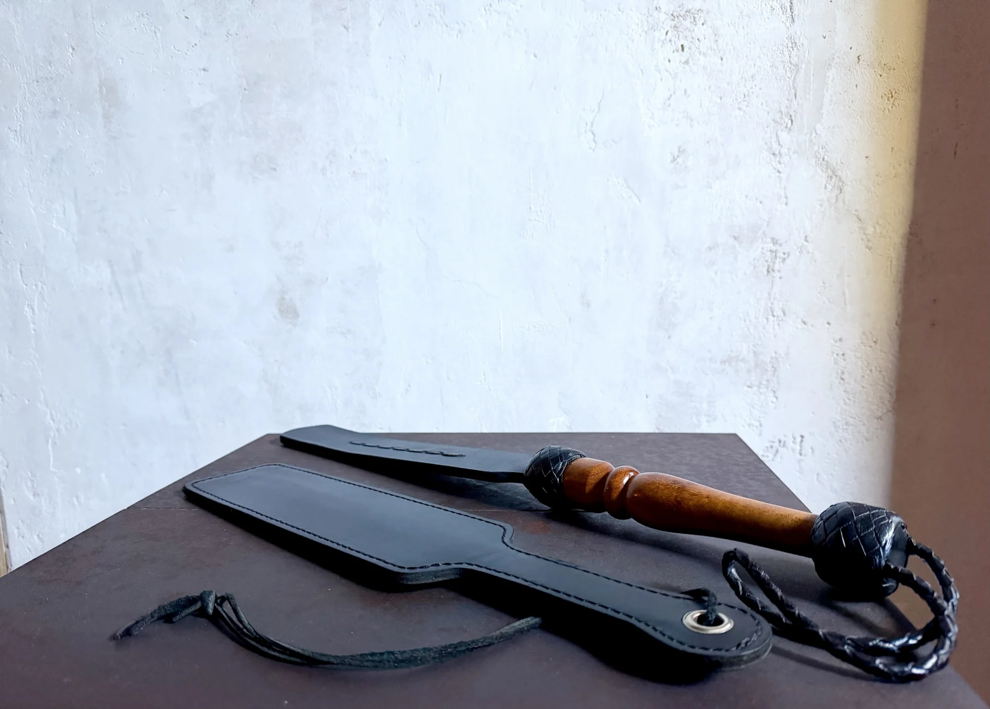Close up of two leather paddles