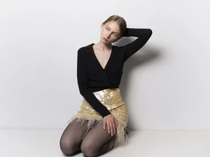 Mistress Domina Hard to Forget in elegant dress with feathers at BDSM Studio LUX Berlin