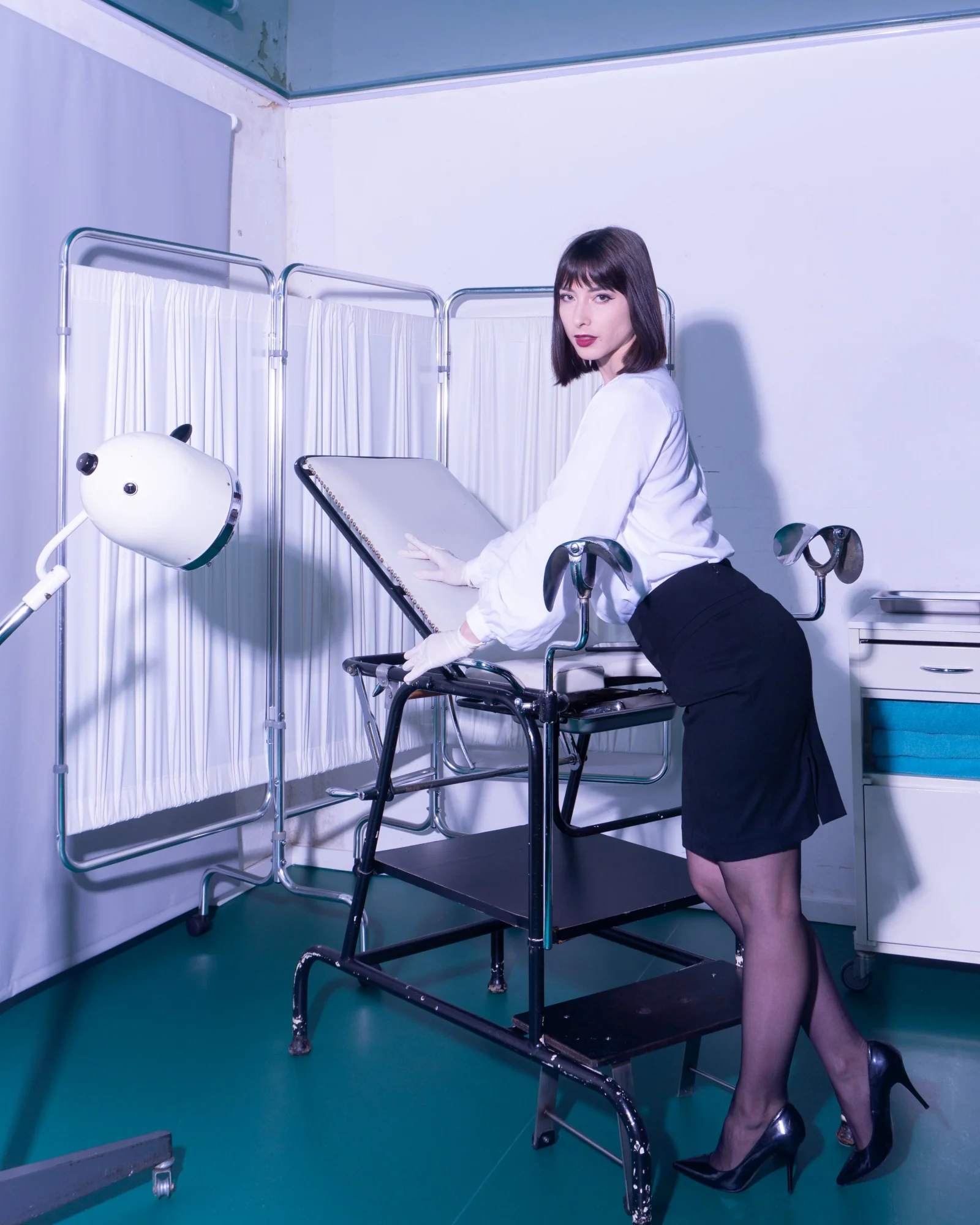 Dominatrix Inara Vesper in the clinic room with a gynecological chair