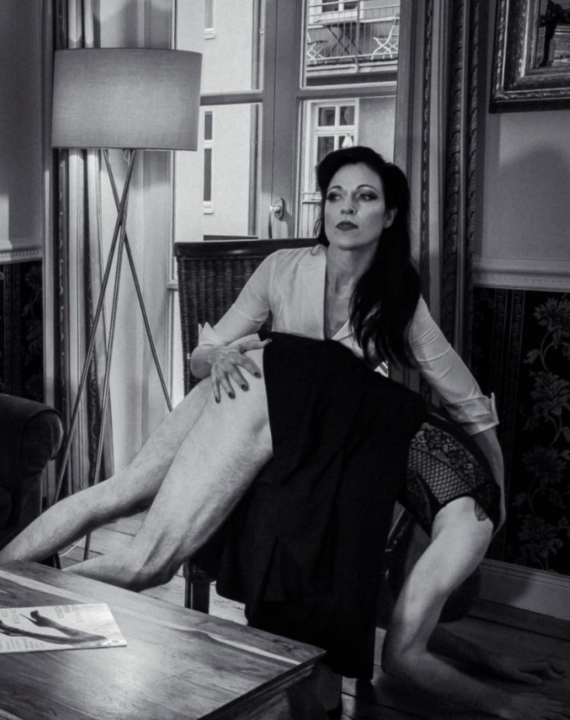 Lady Johanna enjoys some otk spanking, her spankee is on her lap.