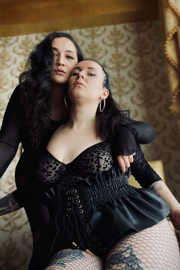 Two Mistresses looking at the pathetic loser