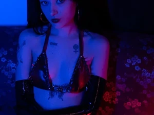 miss ivy malice domina in latex skirt and gloves sitting bdsm studio lux